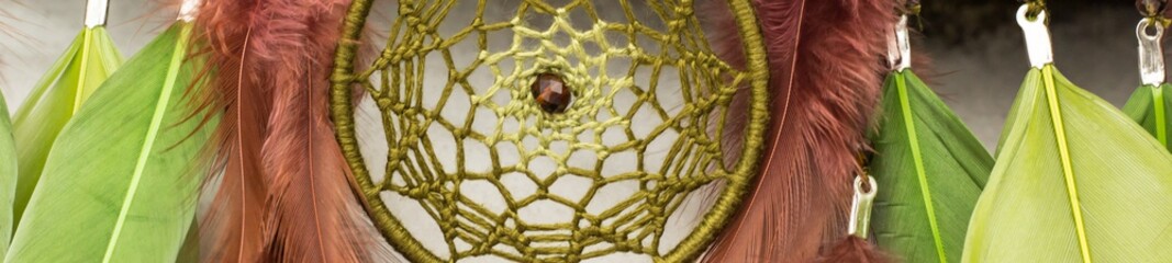 Banner of Handmade dream catcher with feathers threads and beads rope hanging