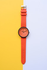 close up of orange wrist watches for background