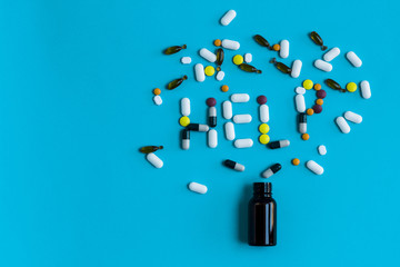 Pill Addiction Concept. Help sign on a blue background