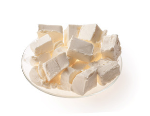 Piece of butter on plate. White background. Isolated