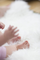 baby feet on white blanket. copy space. selective focus