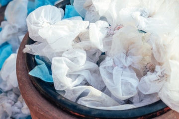 white used medical shoe covers in trash. the concept of hygiene and protection. environmental pollution