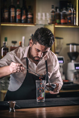 Bartender makes non-alcoholic pomegranate cocktail