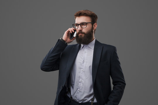 Confident businessman speaking on phone