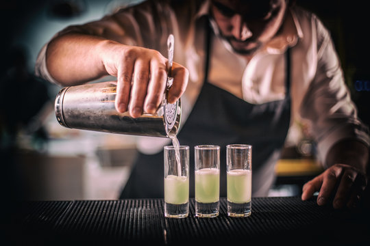 Bartender pouring fresh cocktail