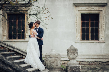 Sensual married couple, valentines hugging in front of old slavi