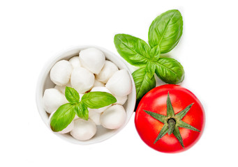 Fresh  Salad  Ingredients with Mozzarella cheese, tomatoes, basil and spices isolated on white background. Food concept. Topp view.