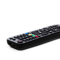 Remote control with a set of numbers lies on a white background. Enlarged image with space for writing text.