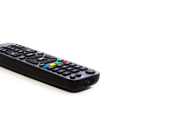 Remote control with a set of numbers lies on a white background. Enlarged image with space for writing text.