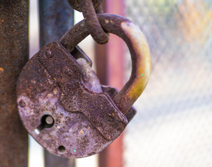 Old lock on the door. lock on the door of an old farmhouse . true village style . close-up. focus on lock.