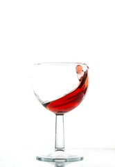 A beautiful splash of wine in a glass