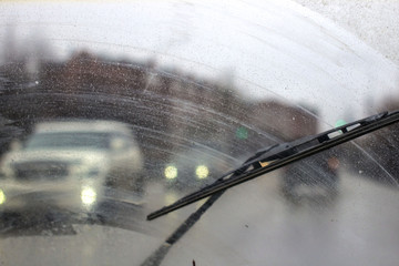 Windshield wipers from inside of car, season rain. - obrazy, fototapety, plakaty