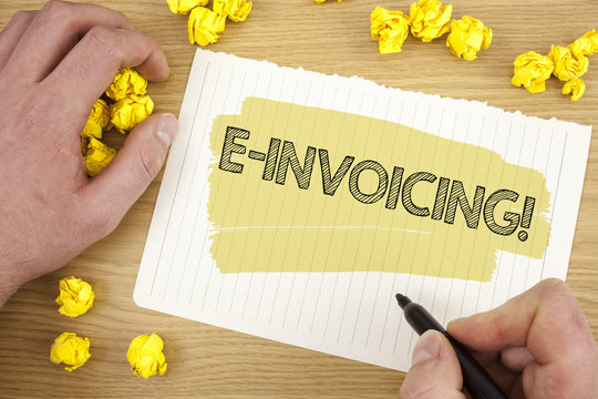 Writing note showing E-Invoicing Motivational Call. Business photo showcasing Company encourages use of digital billing written on Tear Notebook Paper on wooden background Marker Paper Balls.