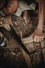 The hand and some activity of old carpenter