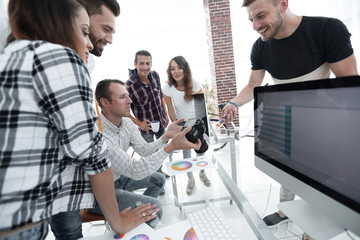 group photo of editors working in a modern office.