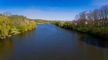 Fototapeta na wymiar Aerial view of lake in the city. Spring time.