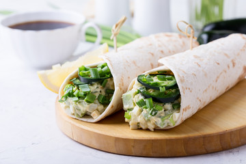 Egg salad and avocado wraps, Mexican style breakfast