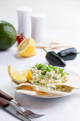 Egg salad with avocado, Mexican style breakfast