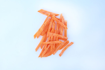Chopped and sliced carrot on white.