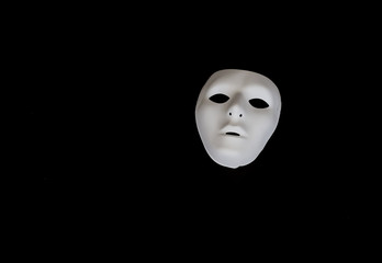 White mask.Suggestive simple white mask on black background