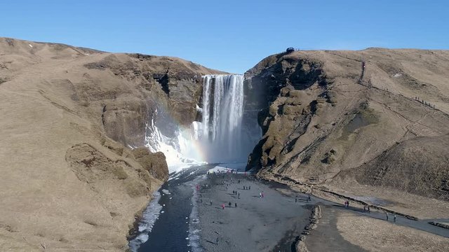 Sk&oacute;gafoss waterfall in south Iceland. Lot's of turists hanging around.