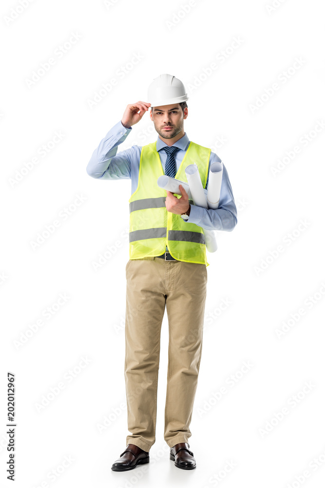 Wall mural Young man in reflective vest and hard hat holding blueprints isolated on white