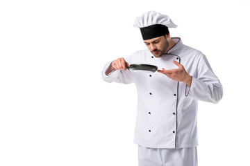 portrait of young chef with frying pan isolated on white
