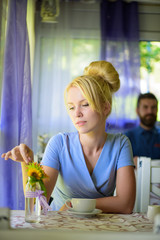 Girlfriend with bored face waits for date in provence interior