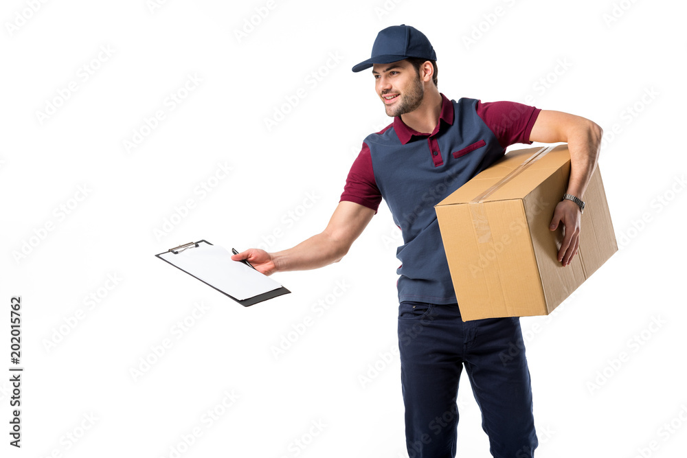 Wall mural smiling delivery man with cardboard box, empty notepad and pen isolated on white