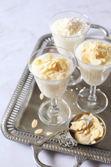 Almond milk pudding with almond petals garnish