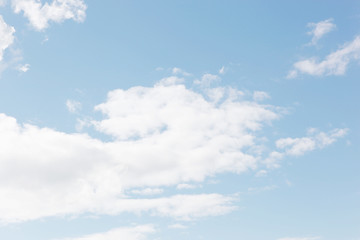 Fototapeta premium Blue sky filled with fluffy white clouds