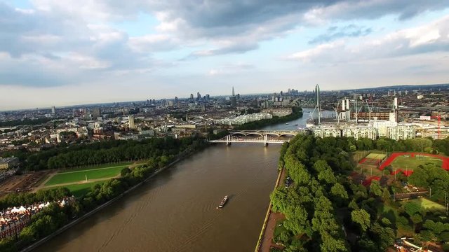 Beautiful Battersea Park and Thames River Aerial Footage around Central London Neighborhood Battersea, Pimlico, Chelsea, Vauxhall feat. London City Skyline on Sunny Day in England United Kingdom HD 4K