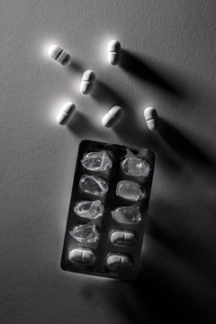 Used drug blister pack and white pills