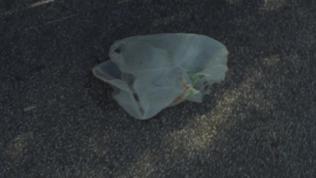 Plastic bag on the street being carried by the wind