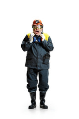 The studio shot of senior bearded male miner standing at the camera on a white background.