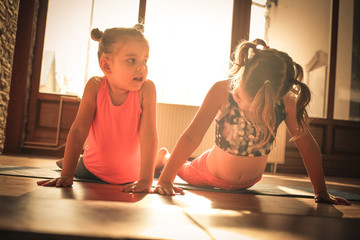 Cute little girls exercise.