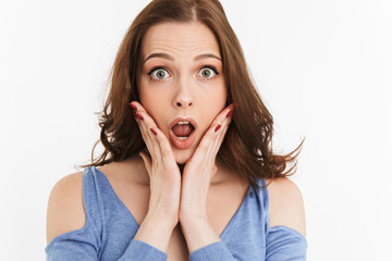 Close up portrait of a surprised young woman screaming