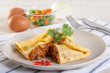 Omelet with vegetable salad and chili