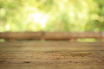 Blur the wood table and the green backdrop.