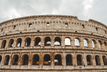 Fototapeta na wymiar ancient Colosseum ruins on cloudy day, Rome, Italy