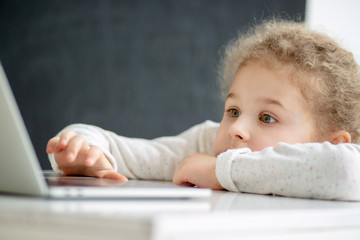 A girl is studying a computer