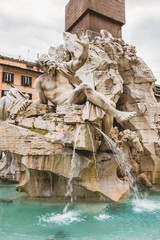 Fototapeta na wymiar statues on Fountain of Four Rivers in Rome, Italy
