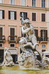 statues on Fountain of Neptune in Rome, Italy