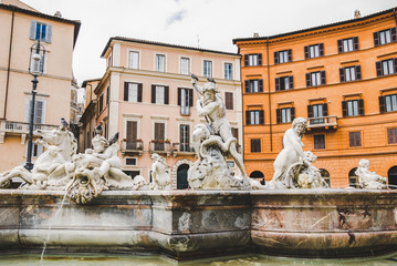 Fototapeta na wymiar statues on Fountain of Neptune at Navona square, Rome, Italy