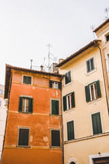 Fototapeta na wymiar bottom view of old orange buildings in Rome, Italy