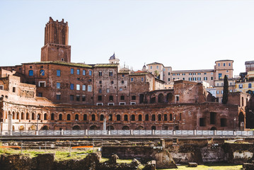 Fototapeta premium view on buildings from Roman Forum ruins in Rome, Italy