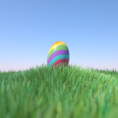 Easter Egg Rainbow colored on green grass hill, 3D Rendering