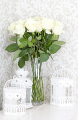 Bouquet of white roses in a vase. White roses and decorative cells
