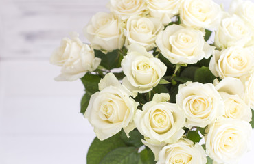 Fototapeta na wymiar Bouquet of white roses in a vase. Bouquet of chic white roses