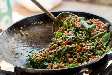 Stir Fried Pork with Basil, Thai food. Proceed. Cooking. Look delicious.